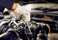 Auto mechanic Preparing For the work. Mechanic with Stainless Steel Wrench in Hand.Close up of hands mechanic doing car service and maintenance.
